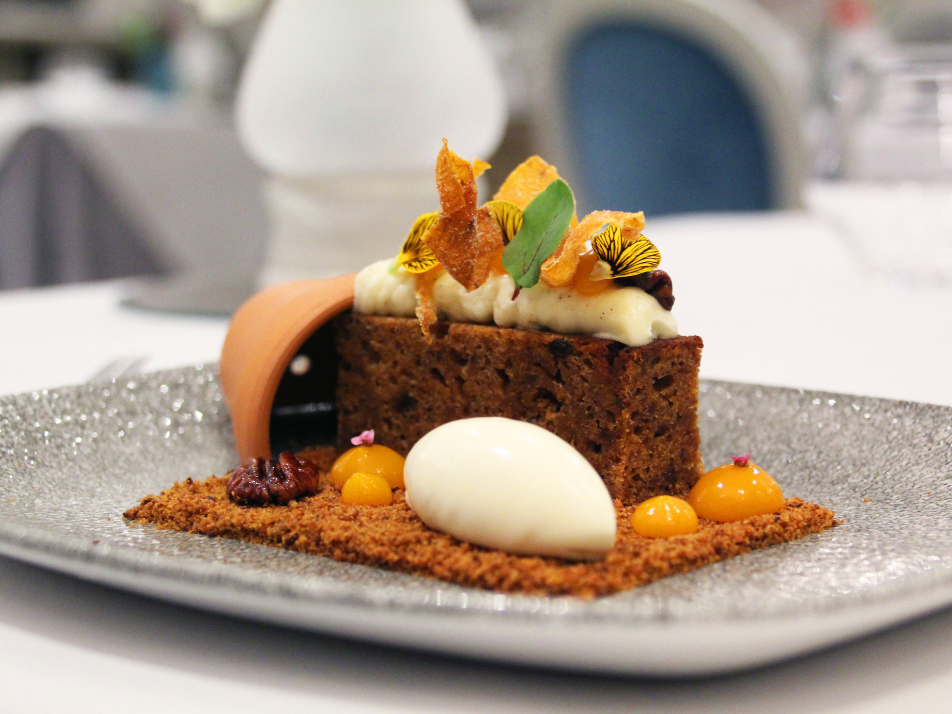 Murrays famous ginger cake served with breadcrumbs, scoop of ice cream and themed to look like it is coming out of a plant pot