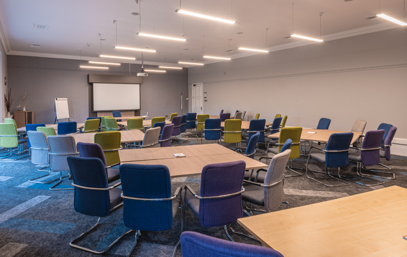 A syndicate meeting room with cabaret laid out tables