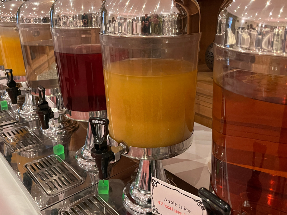 A selection of juices filled in jug dispensers