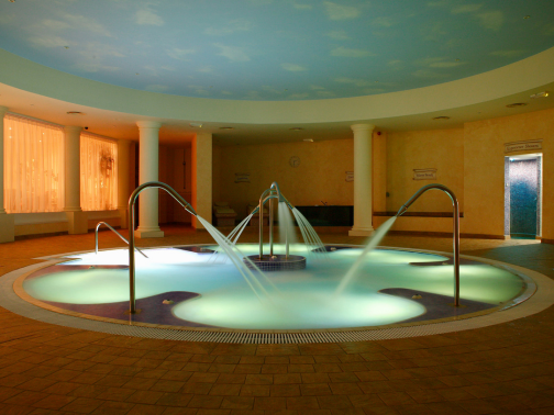 A hydrotherapy pool within a roman themed spa