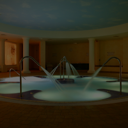 A hydrotherapy pool within a roman themed spa