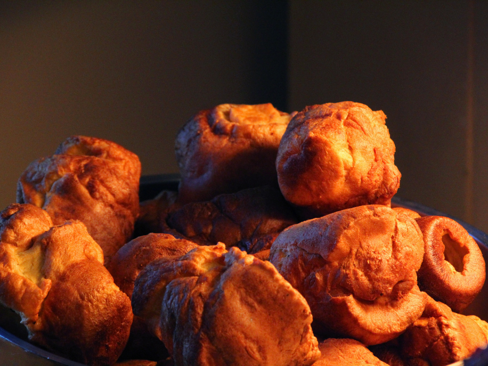 A large stack of crispy Yorkshire puddings